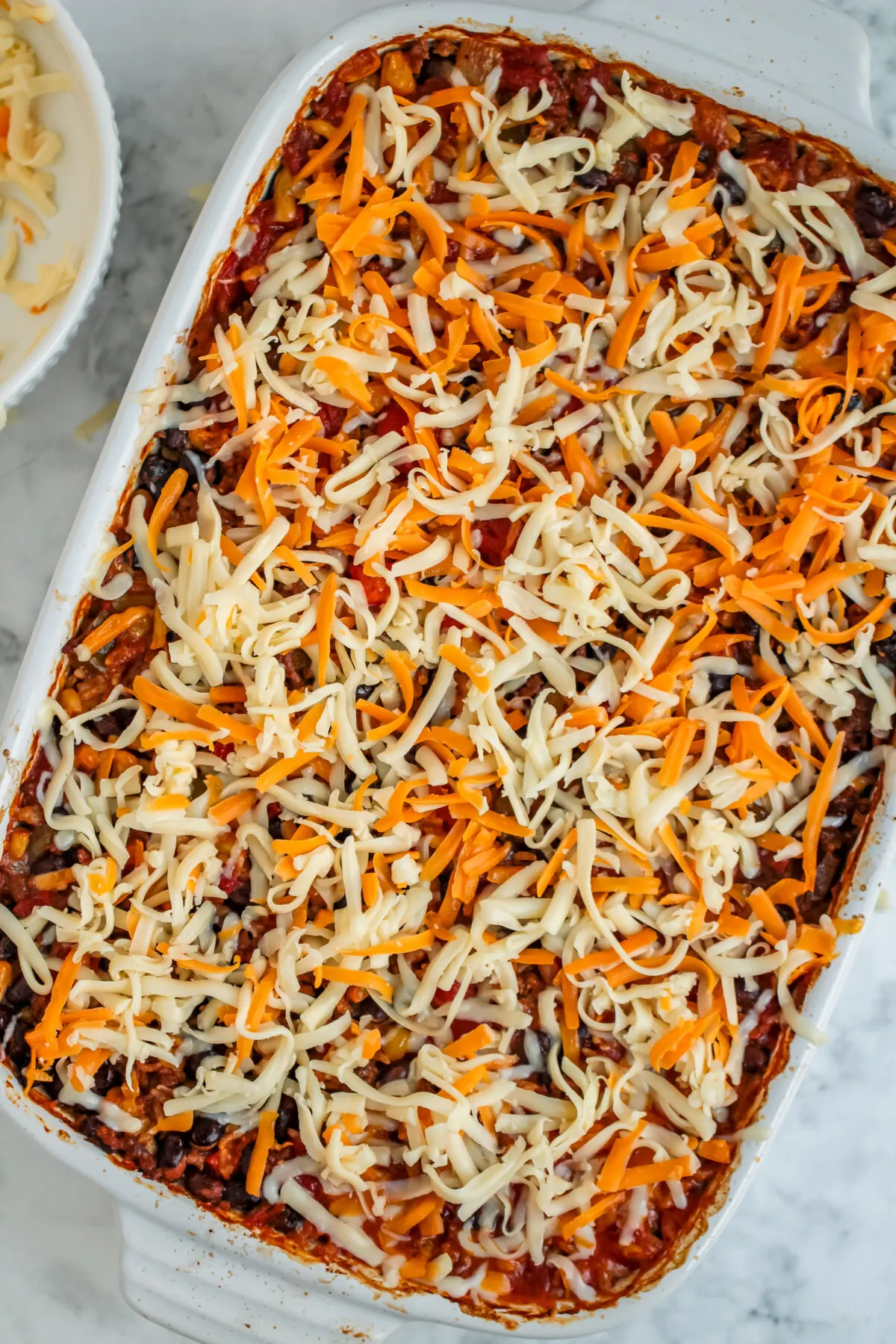 Baked casserole topped with cheese,