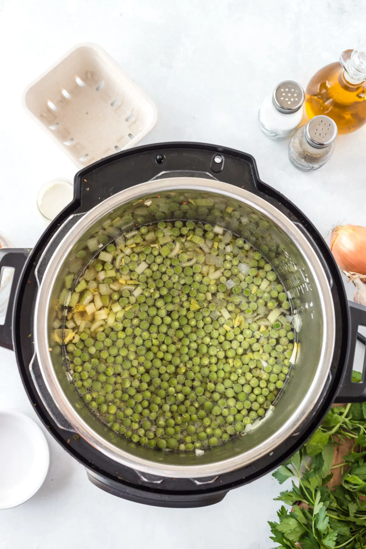 Fresh peas and vegetable base ready to cook in the instant pot.
