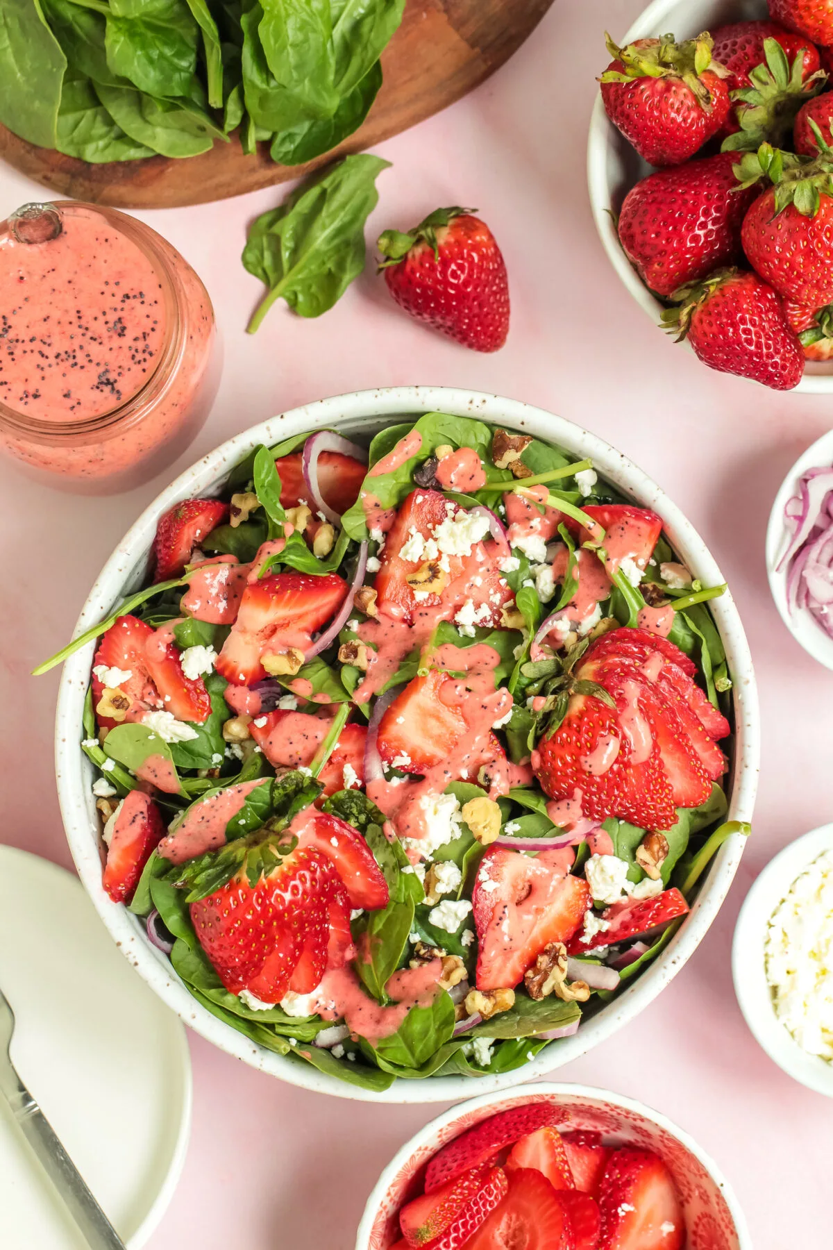 A summer salad recipe perfect for any occasion, this strawberry spinach salad is easy to make and features a strawberry poppy seed dressing.
