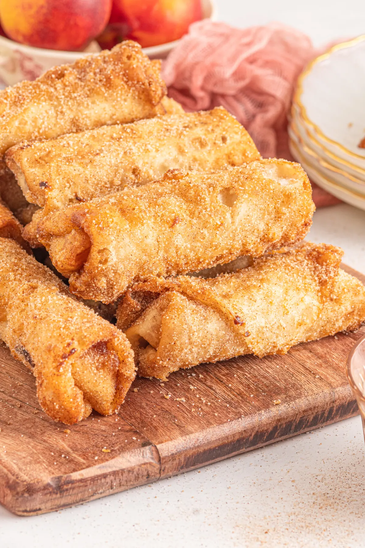 These Peach Cobbler egg rolls combine the sweet taste of peaches, with cinnamon and sugar, all wrapped up in crispy egg roll wrappers.