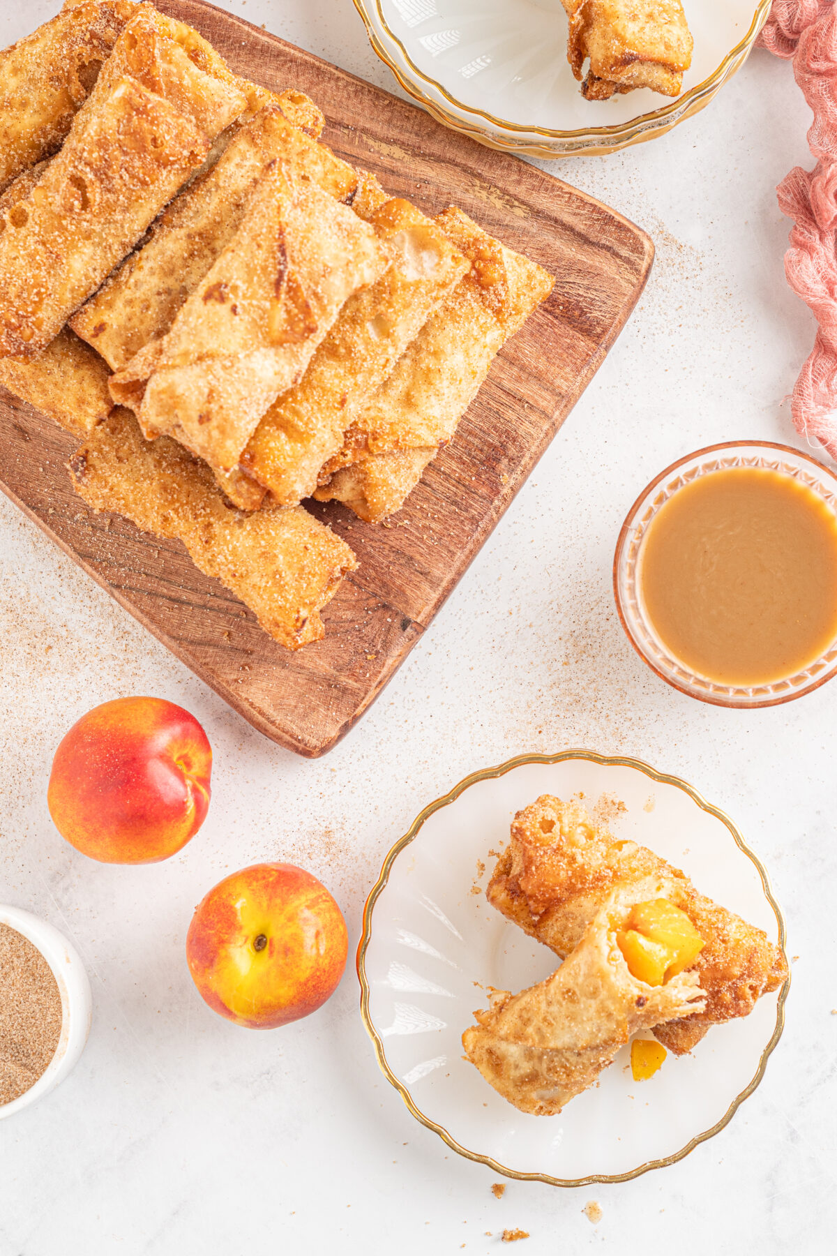 These Peach Cobbler egg rolls combine the sweet taste of peaches, with cinnamon and sugar, all wrapped up in crispy egg roll wrappers.