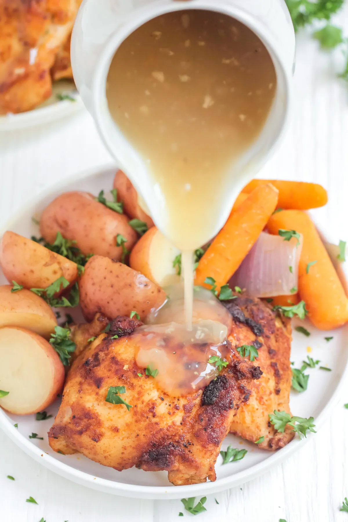This easy slow cooker chicken thighs and potatoes recipe is perfect for a busy family. With carrots, it's a crock pot meal that's complete!
