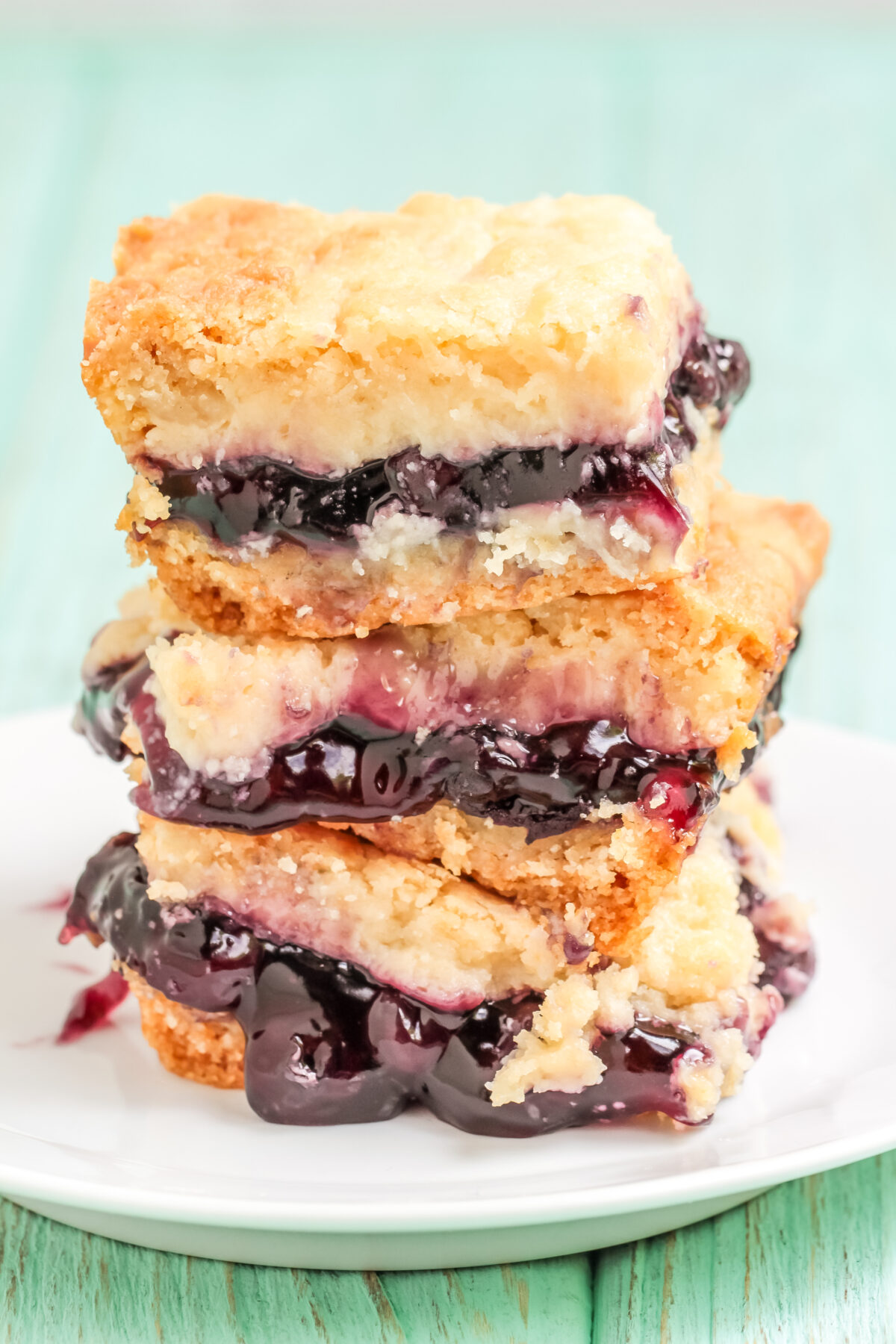 Made with cake mix and pie filling, this blueberry cream cheese bars recipe is a delicious and easy dessert that is perfect for any occasion!