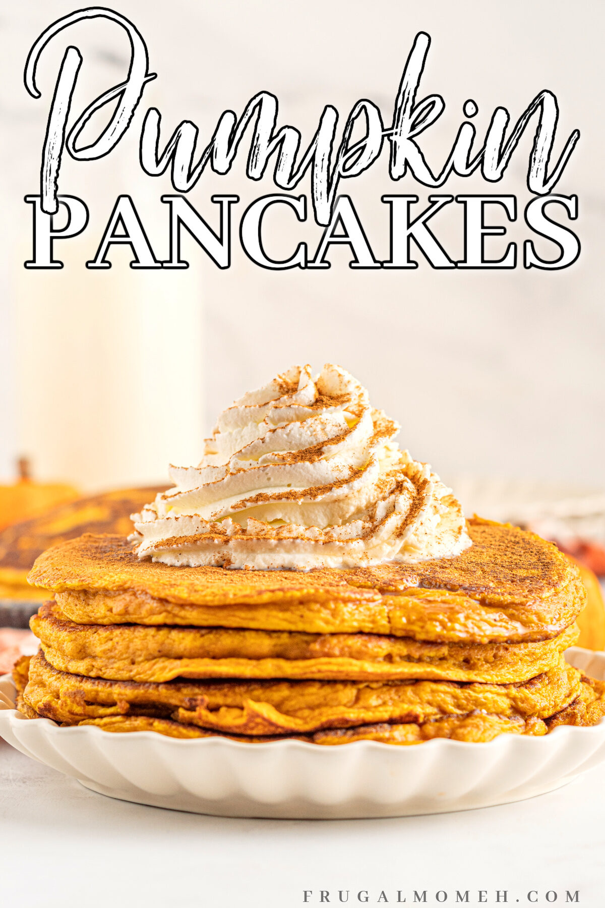 This easy pumpkin pancakes recipe uses real pumpkin, and has the perfect blend of warming spices for a delicious fall brunch or breakfast.