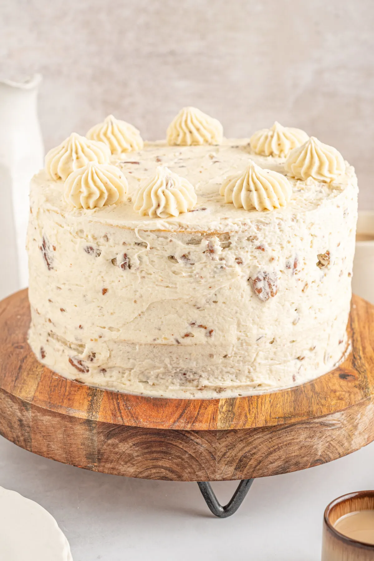 Loaded with buttery pecans, this delicious and moist butter pecan cake is layered with a rich cream cheese frosting. This cake is the best!