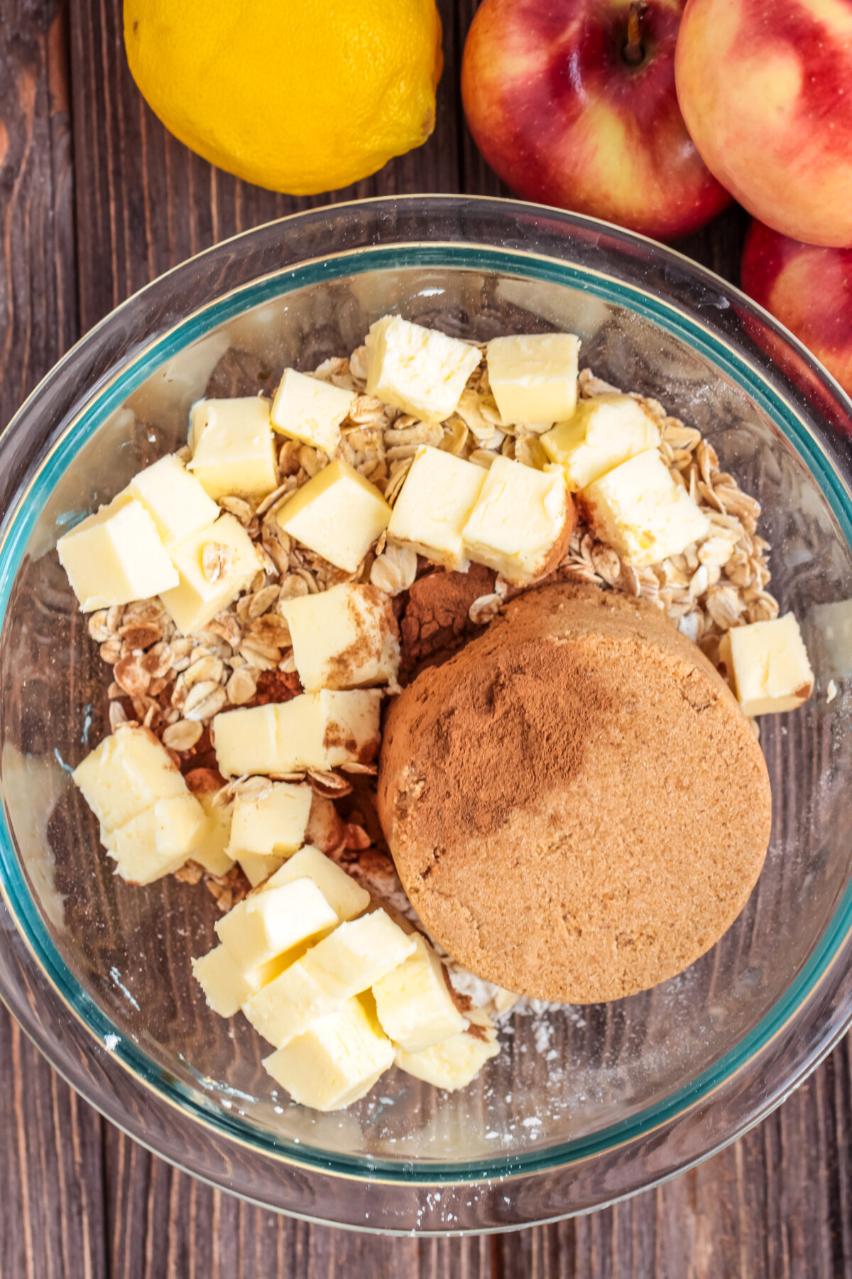 Apple crisp topping ingredients in a glass bowl.