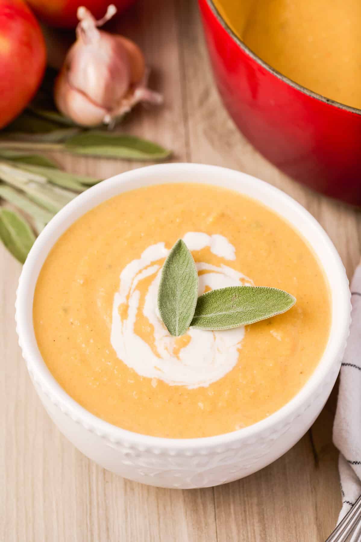 Creamy Apple Butternut Squash Soup is packed with fall flavour from sweet apples, squash, and sage. Perfect for cosy dinners or Thanksgiving.