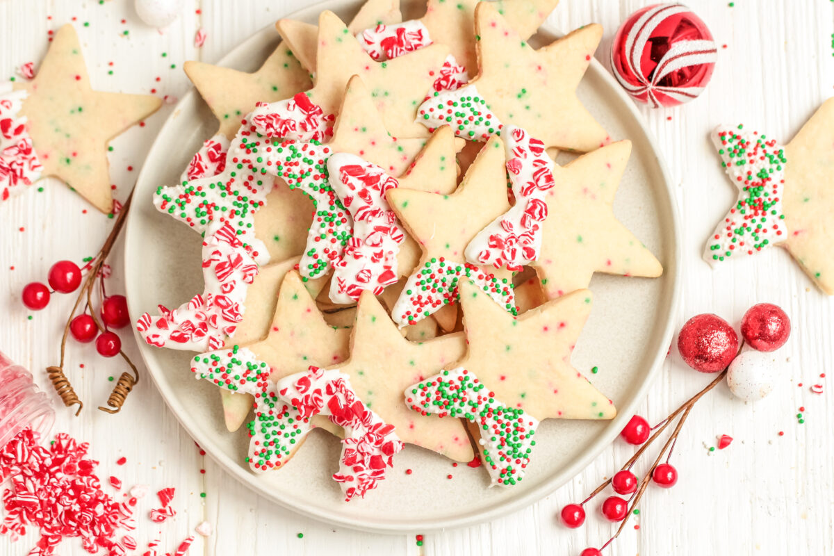 Chocolate Dipped Christmas Sprinkle Cookies are a fun addition to your holiday cookie platter. They're festive, delicious, and easy to make!