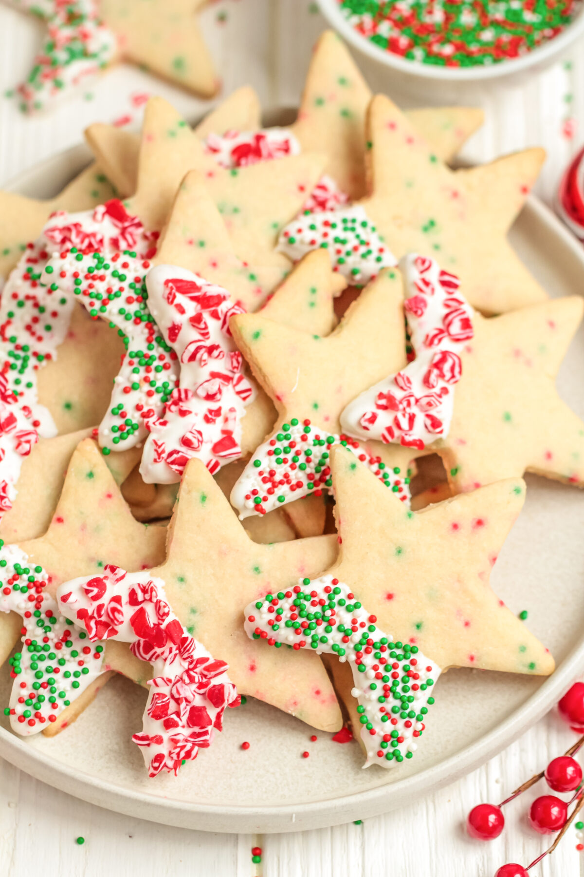 Chocolate Dipped Christmas Sprinkle Cookies are a fun addition to your holiday cookie platter. They're festive, delicious, and easy to make!
