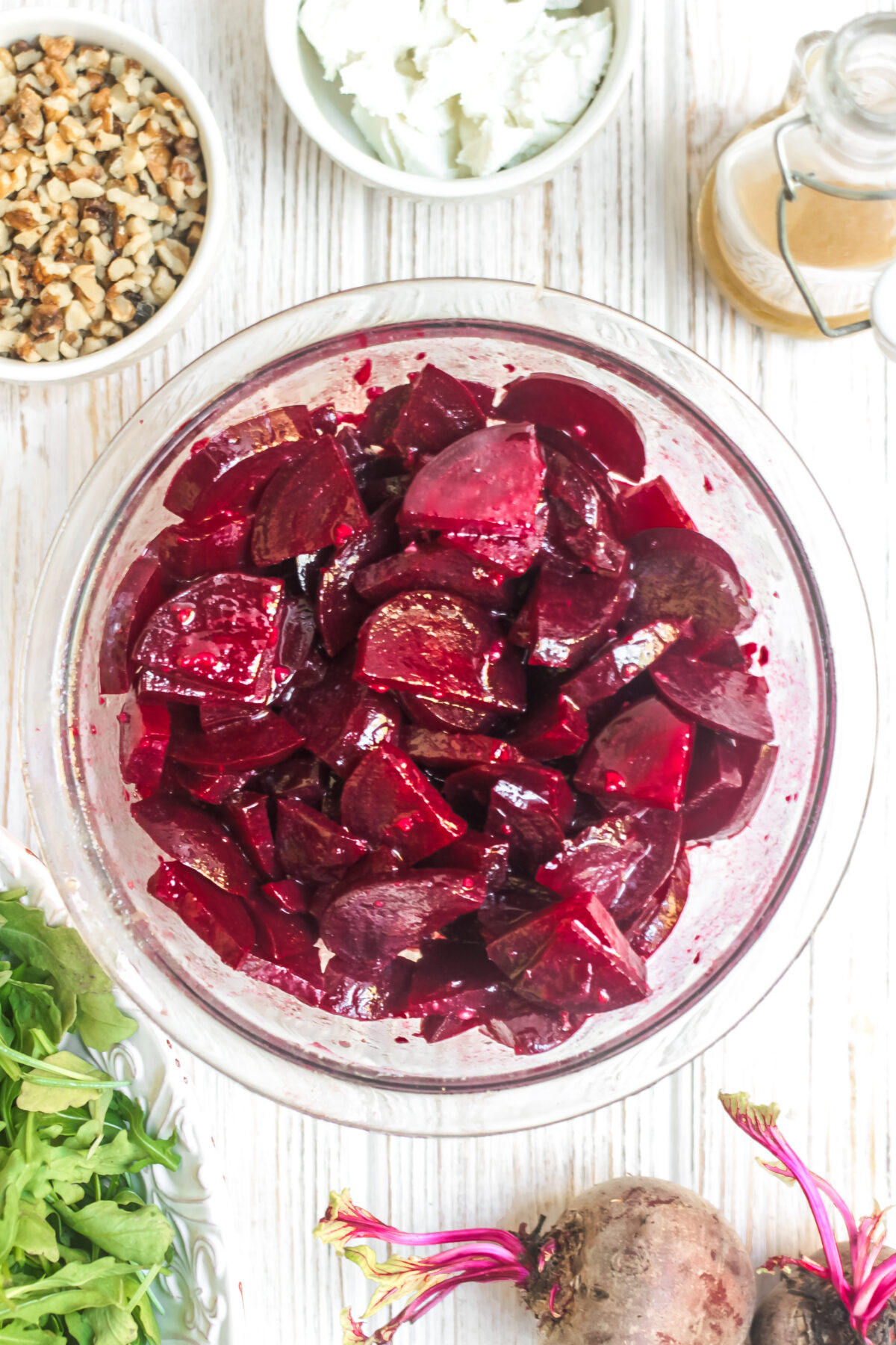 Beets marinating in a glass bowl.
