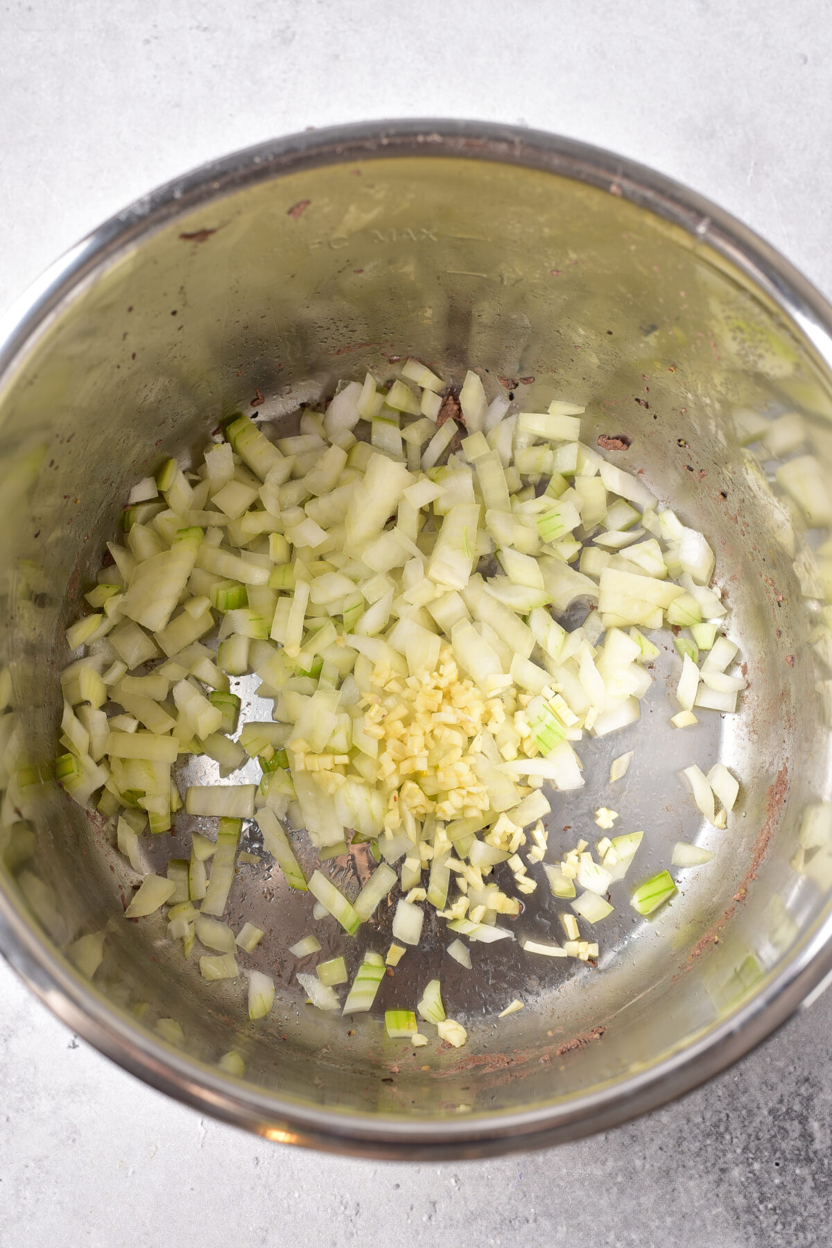 Onions and garlic cooking in the instant pot.