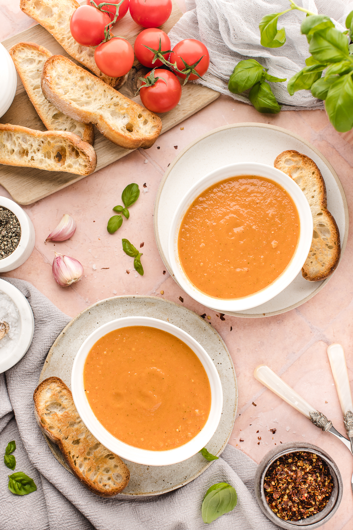 This easy roasted tomato soup recipe is healthy, hearty, and delicious - plus, it's affordable and simple to make! It's naturally vegan too!