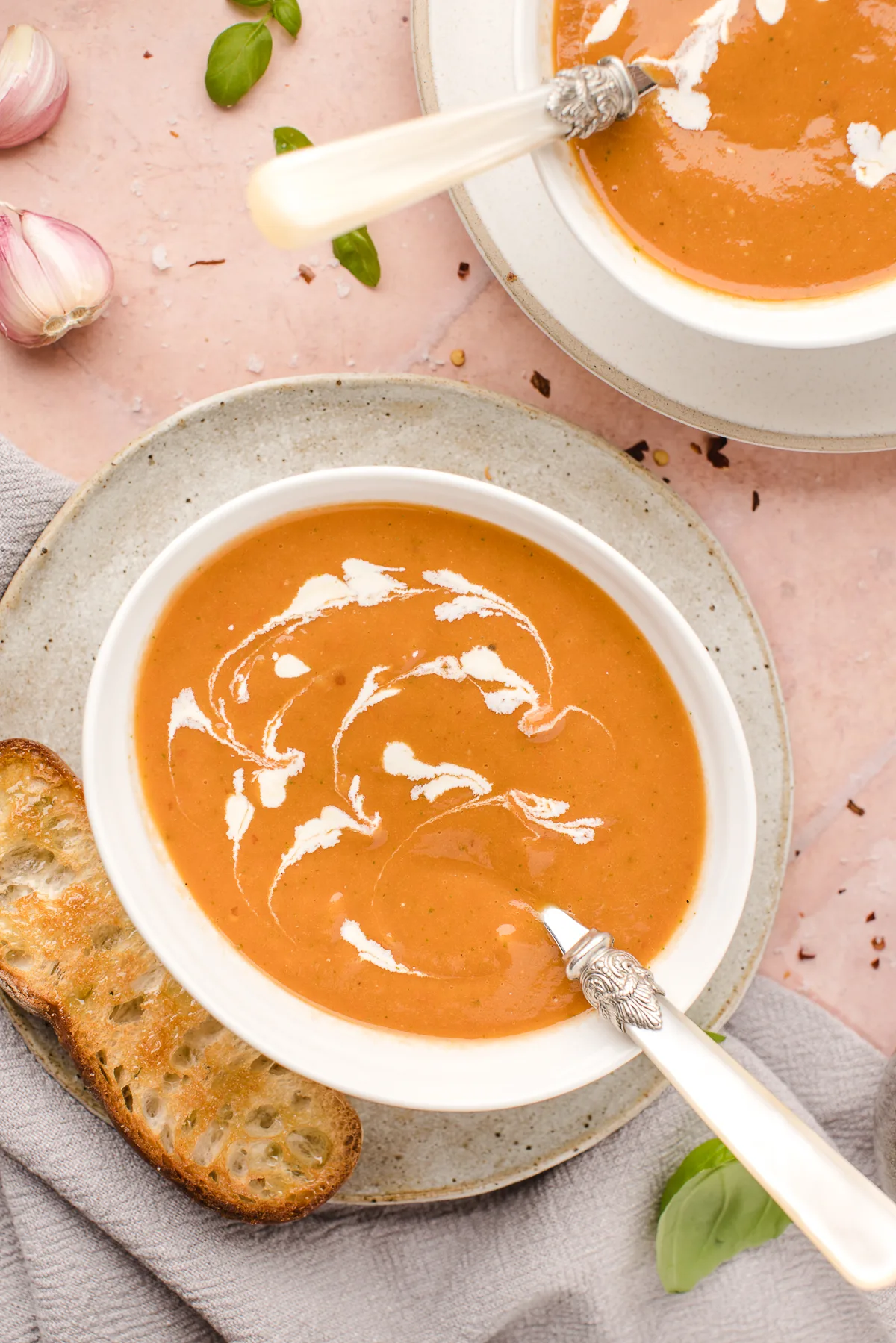 This easy roasted tomato soup recipe is healthy, hearty, and delicious - plus, it's affordable and simple to make! It's naturally vegan too!