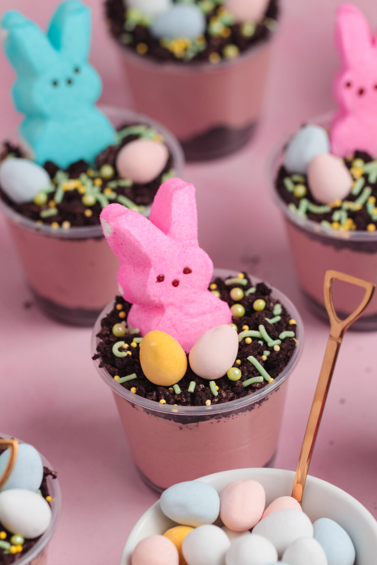 This fun and easy Easter Dirt Cups recipe features a velvety chocolate cheesecake filling, oreo crumbs, and adorable peeps bunnies!