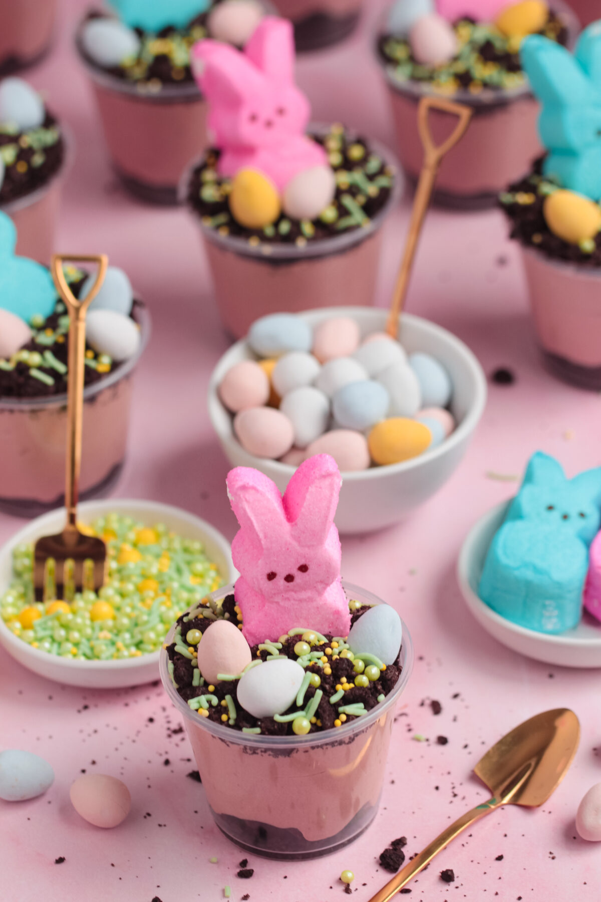 This fun and easy Easter Dirt Cups recipe features a velvety chocolate cheesecake filling, oreo crumbs, and adorable peeps bunnies!