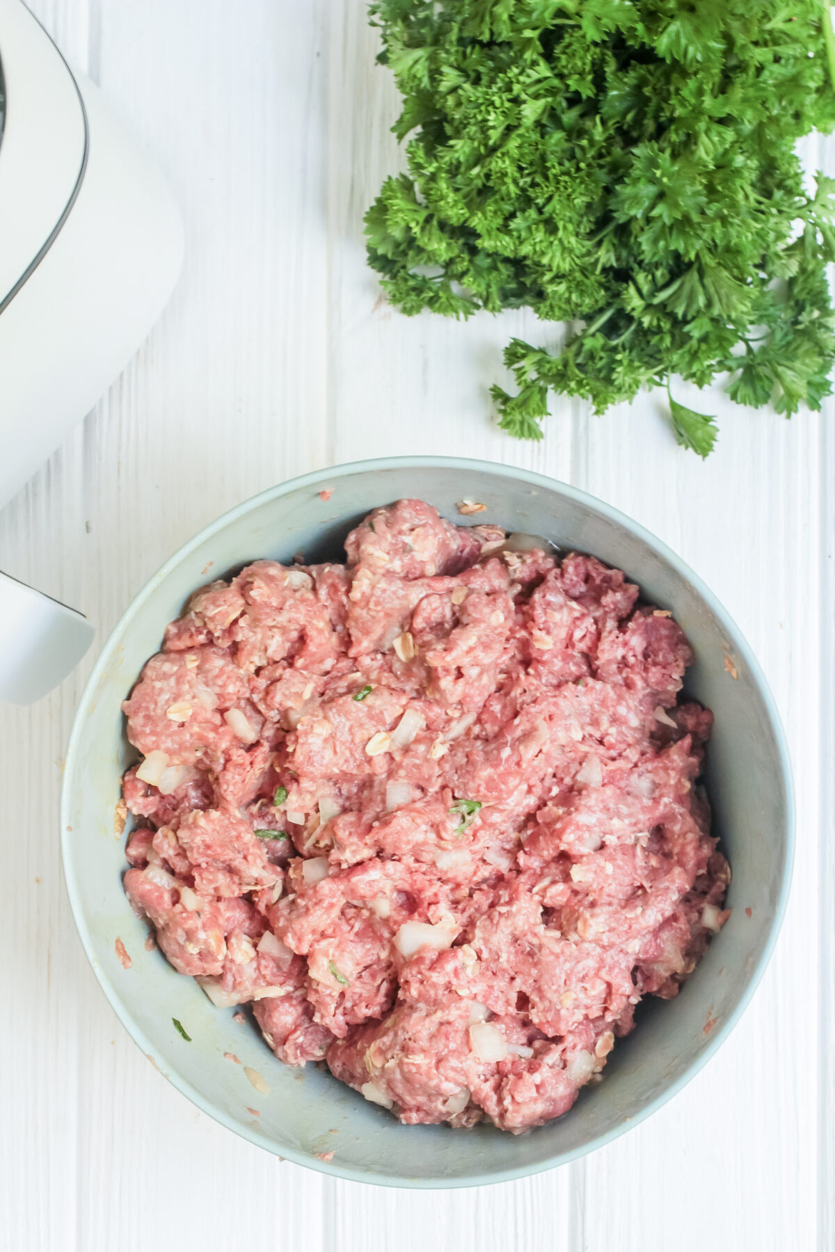 Meatloaf mixture combined in a bowl.