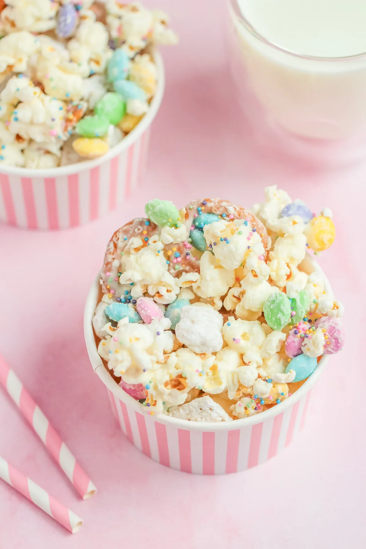 This bunny bait recipe is a tasty Easter snack mix made with popcorn, pastel M&M's, pretzels, white chocolate, sprinkles, and muddy buddies.