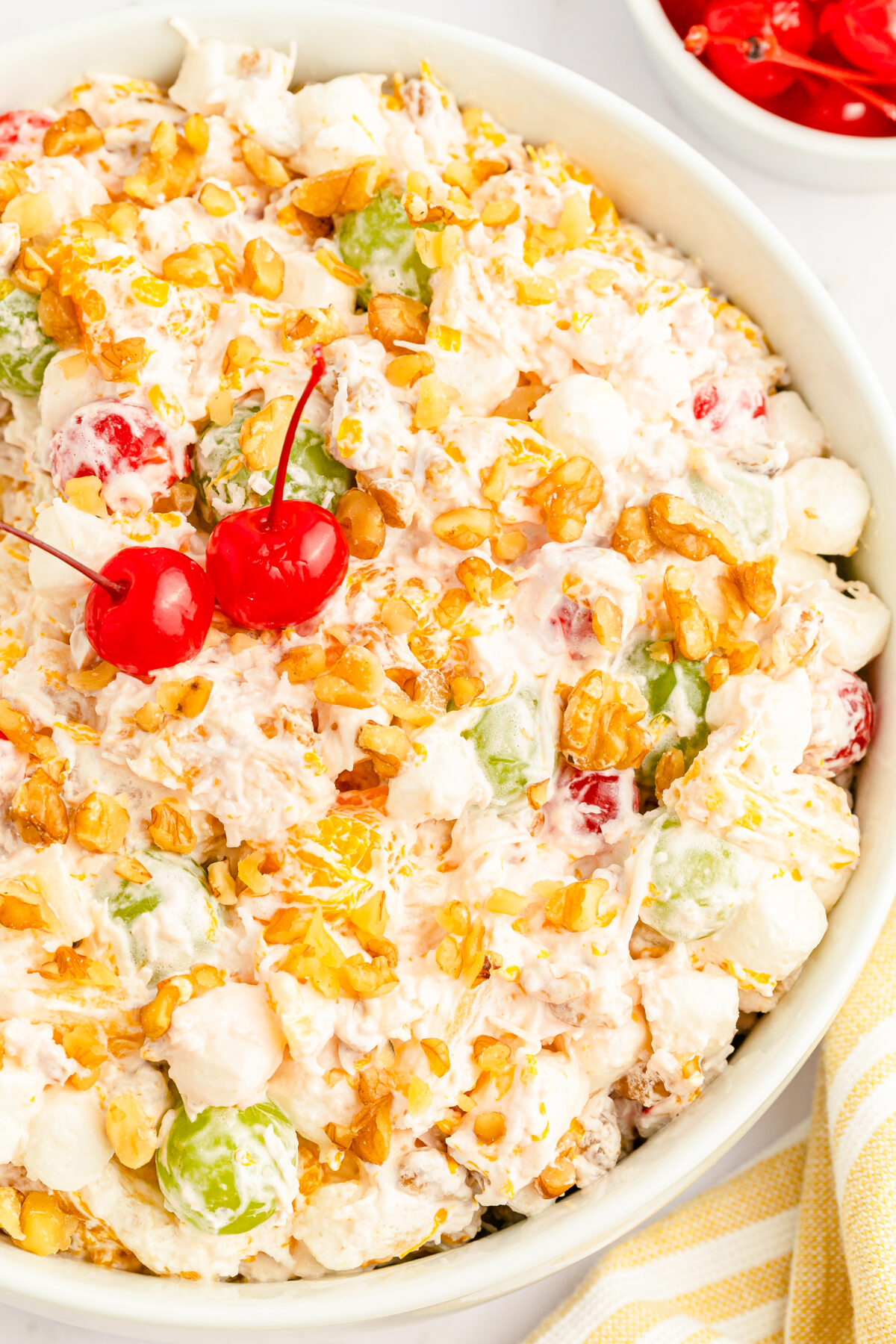 A classic ambrosia salad recipe that is sure to impress - this vintage salad features fruit tossed in a creamy dressing with marshmallows!