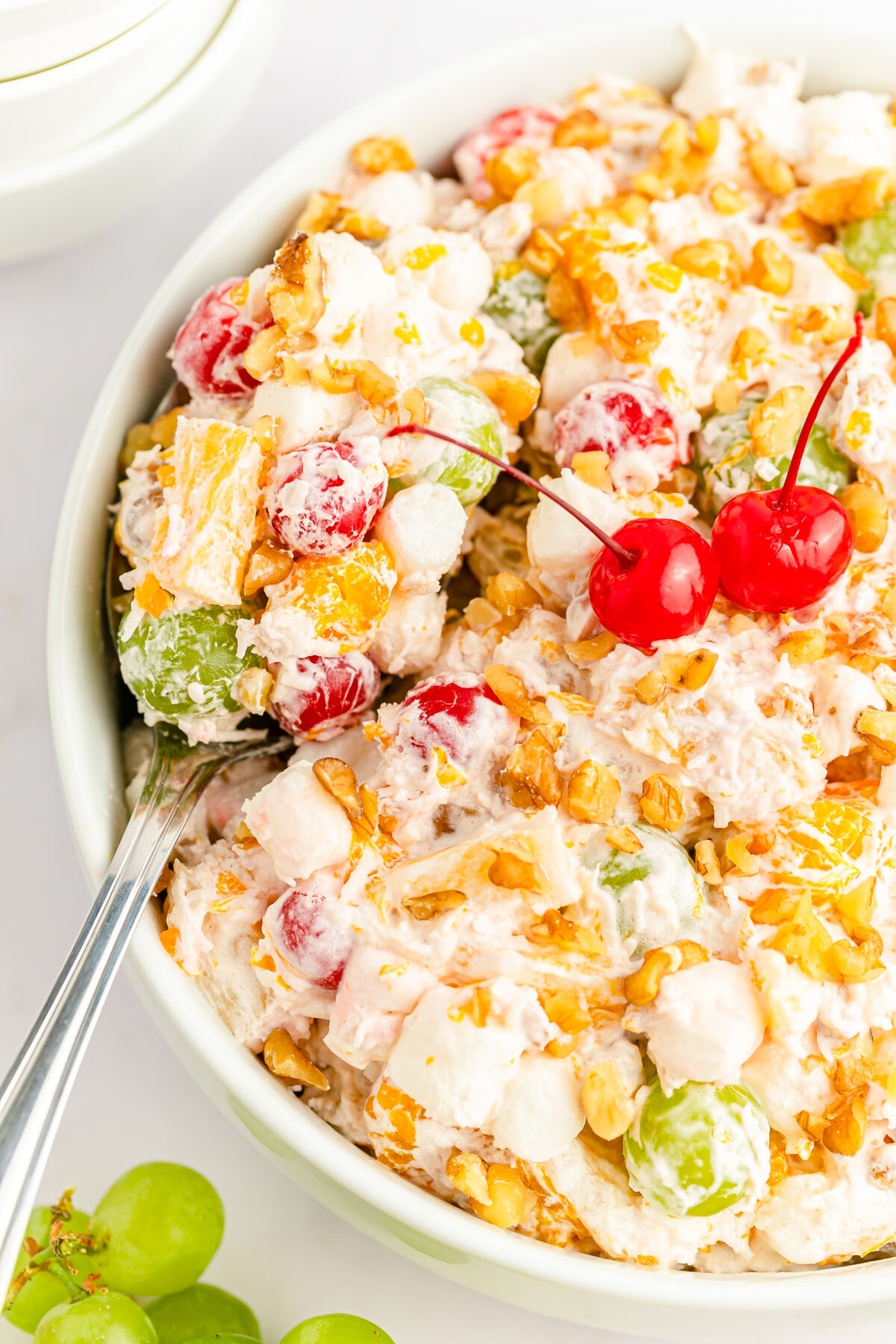 A classic ambrosia salad recipe that is sure to impress - this vintage salad features fruit tossed in a creamy dressing with marshmallows!