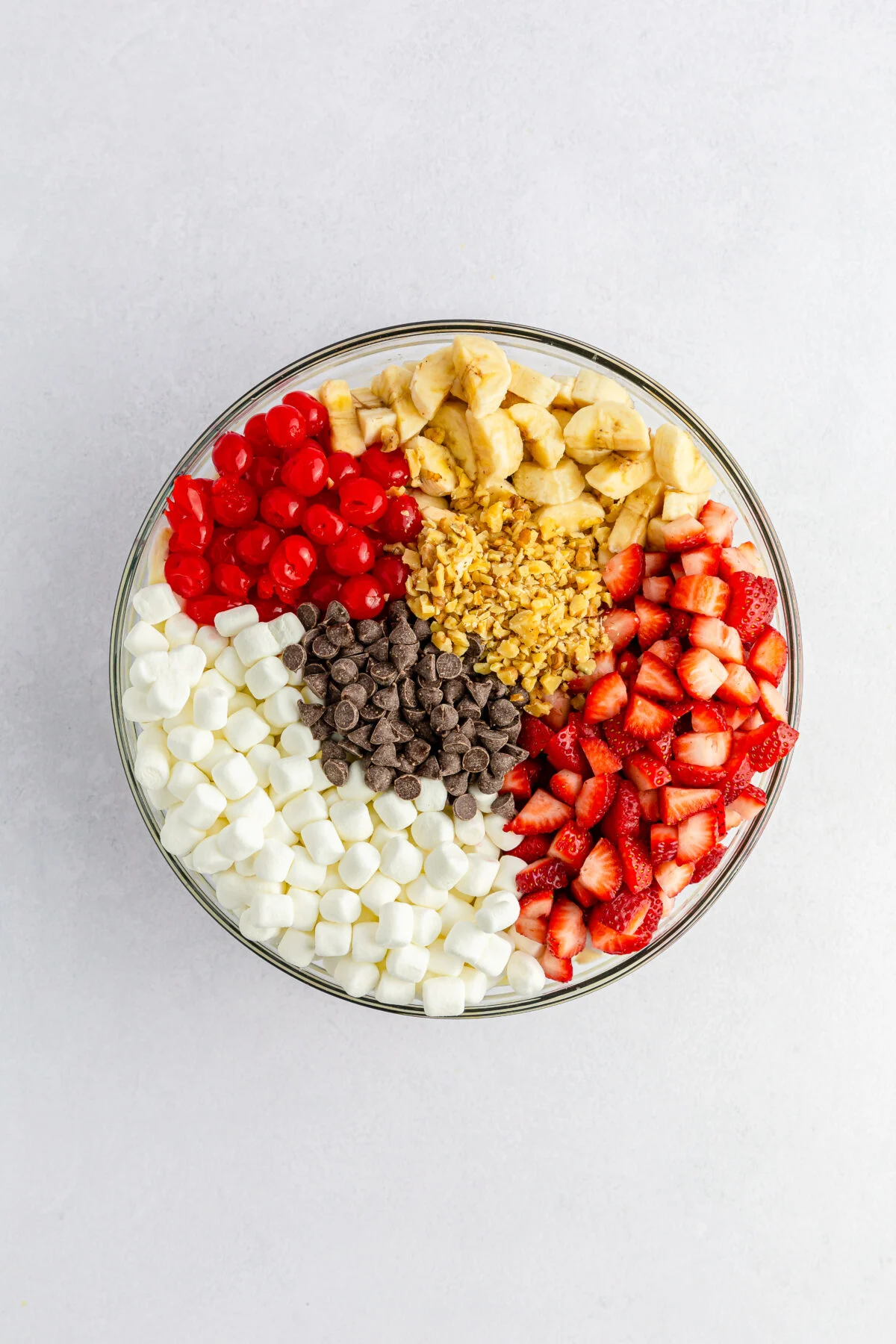 Fruit, marshmallows, chocolate, and nuts added to the dressing.