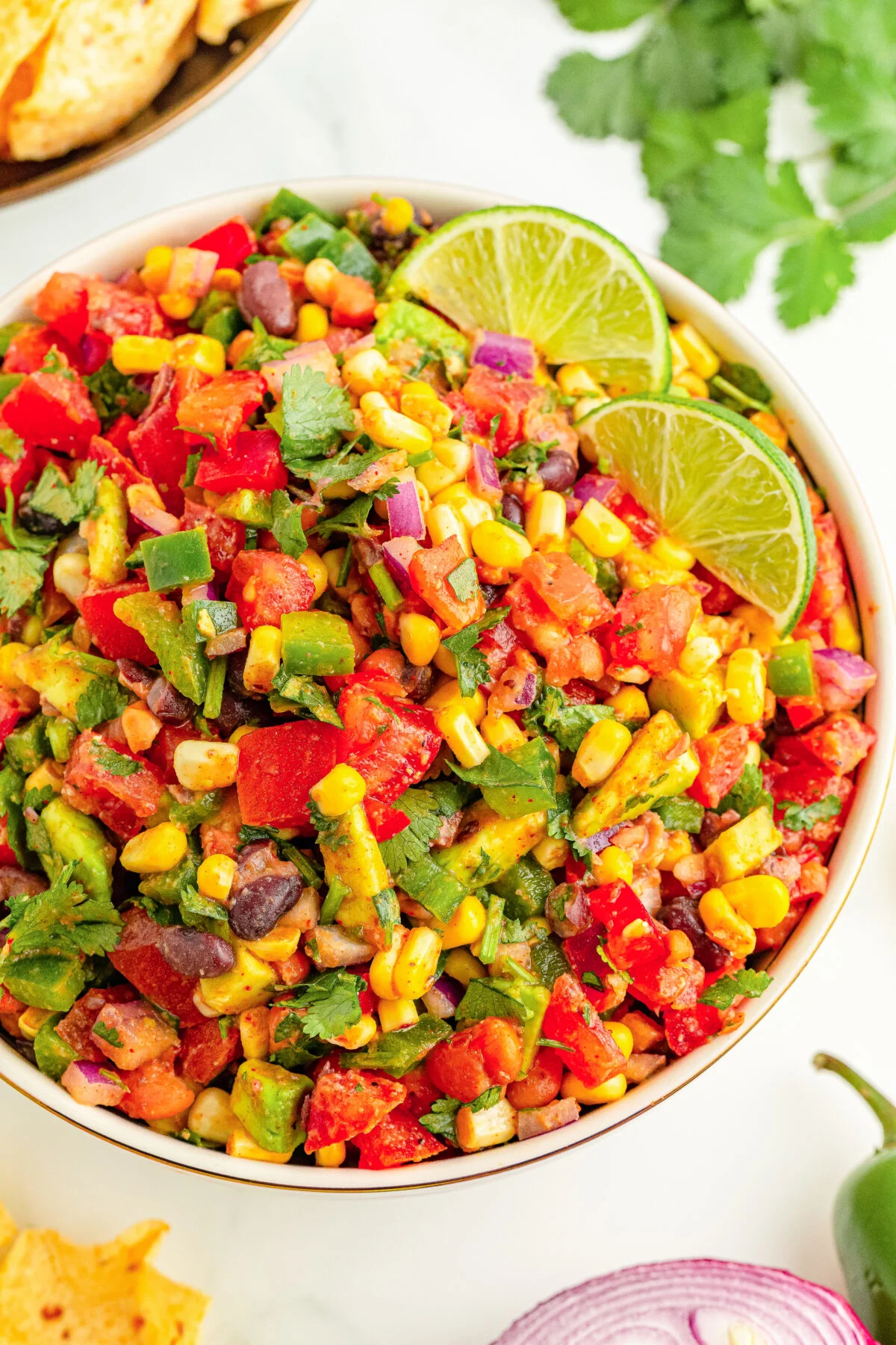 Discover a hearty cowboy caviar recipe, loaded with beans and fresh produce tossed in zesty lime dressing for a delicious, flavoursome dish.