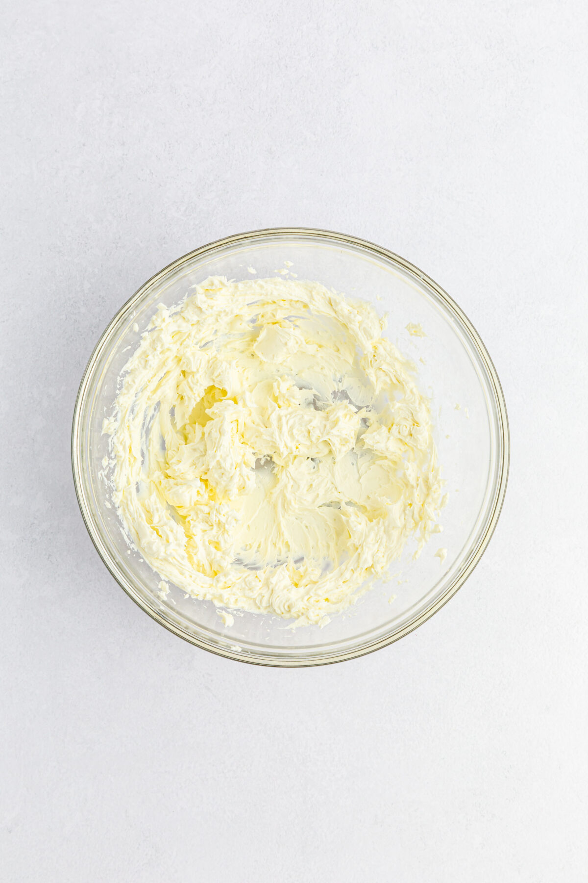 Cream cheese beaten until smooth in a mixing bowl.