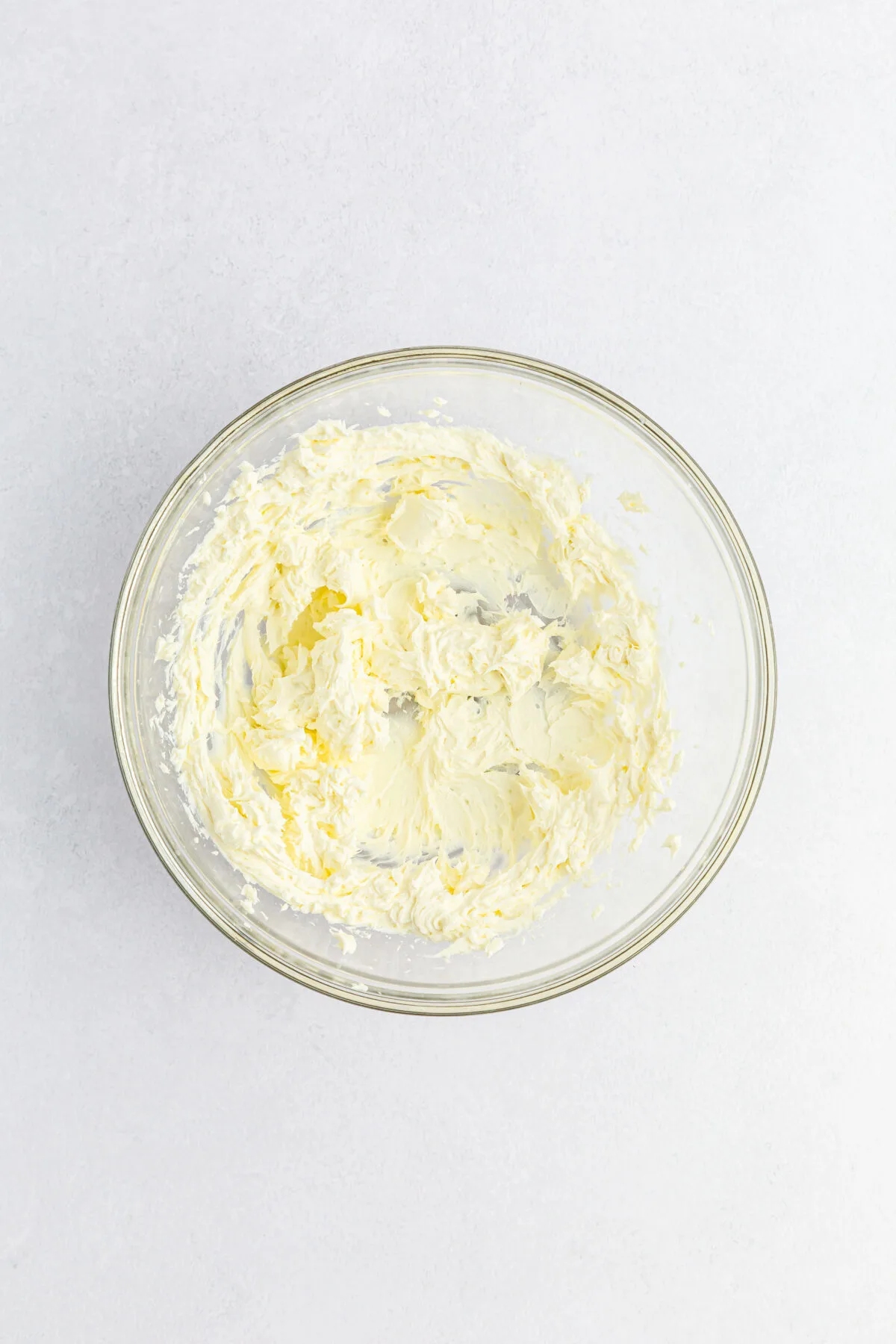 Cream cheese beaten until smooth in a mixing bowl.