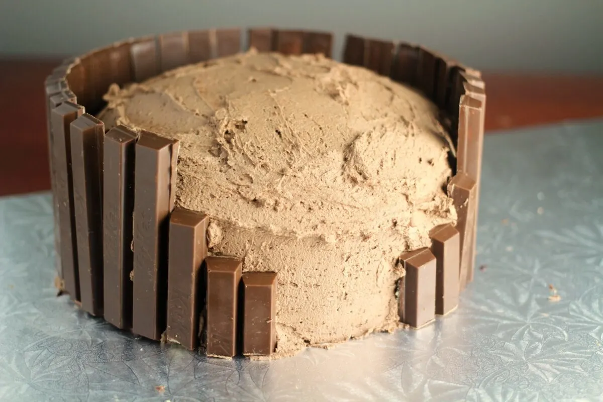 Cake sides covered in kit kat bars to look like a fence.