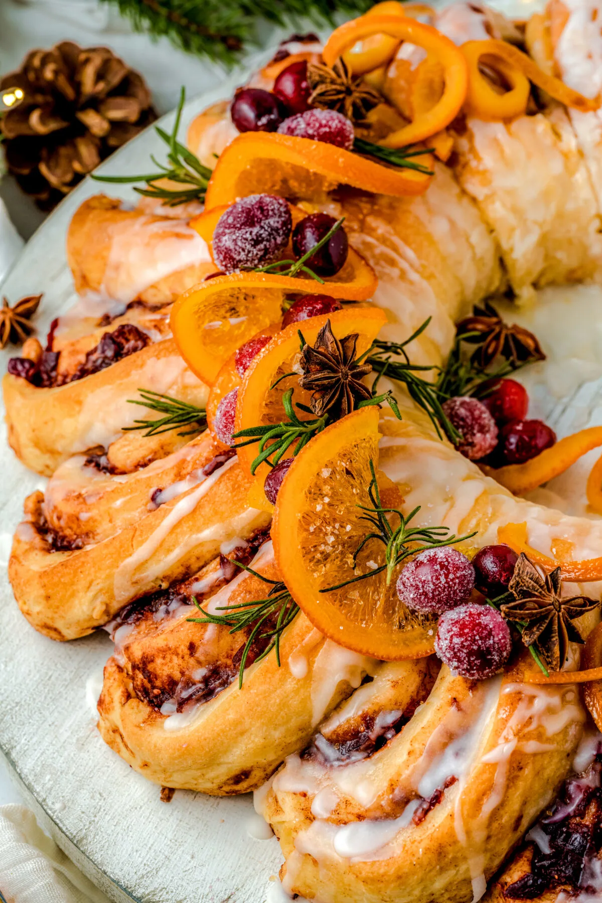 Make your holiday season extra special with this delicious Cranberry Orange Cinnamon Roll Wreath. It's sure to be a hit at any holiday party!