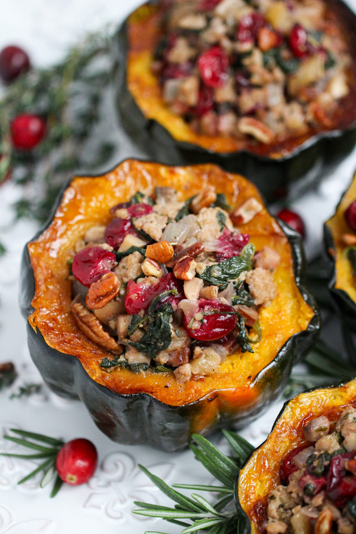 Make the perfect fall or winter dish with this simple, savoury sausage stuffed acorn squash recipe. It's delicious and comforting!