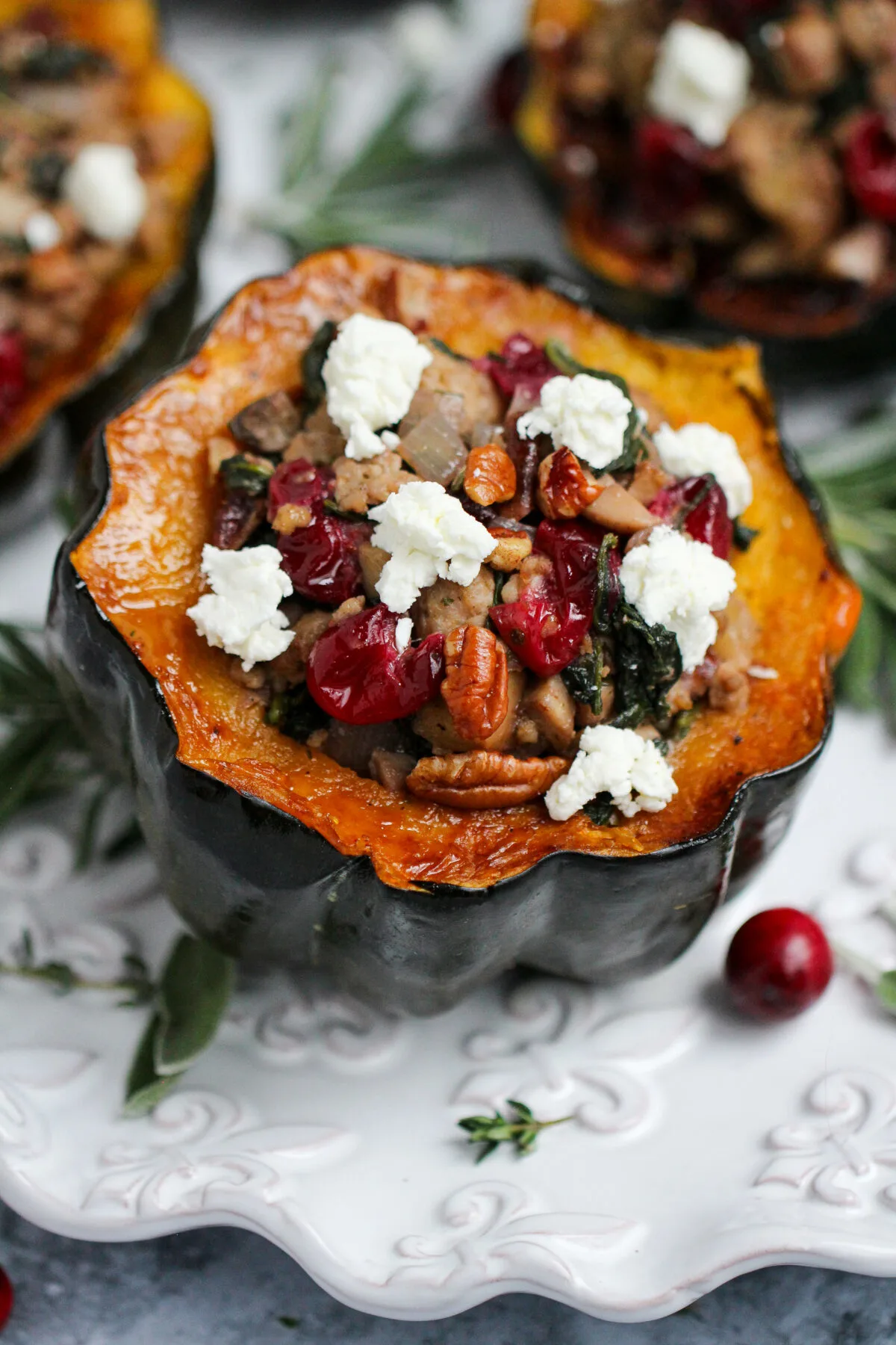 Make the perfect fall or winter dish with this simple, savoury sausage stuffed acorn squash recipe. It's delicious and comforting!