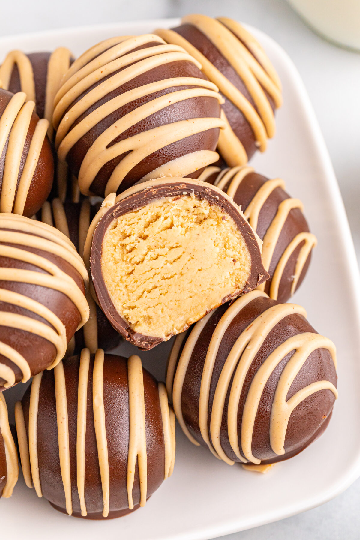 Indulge in the perfect combination of creamy peanut butter and rich chocolate with these irresistible chocolate covered peanut butter balls.