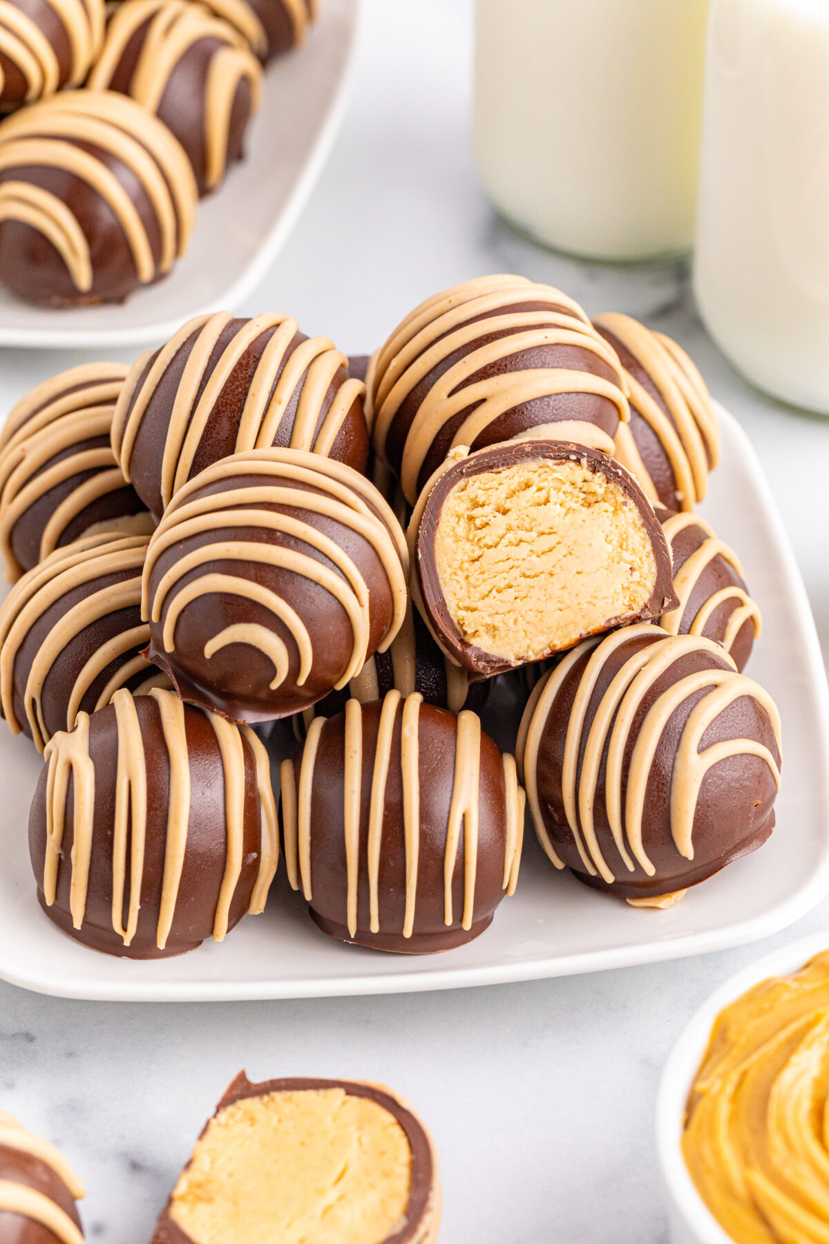 Indulge in the perfect combination of creamy peanut butter and rich chocolate with these irresistible chocolate covered peanut butter balls.