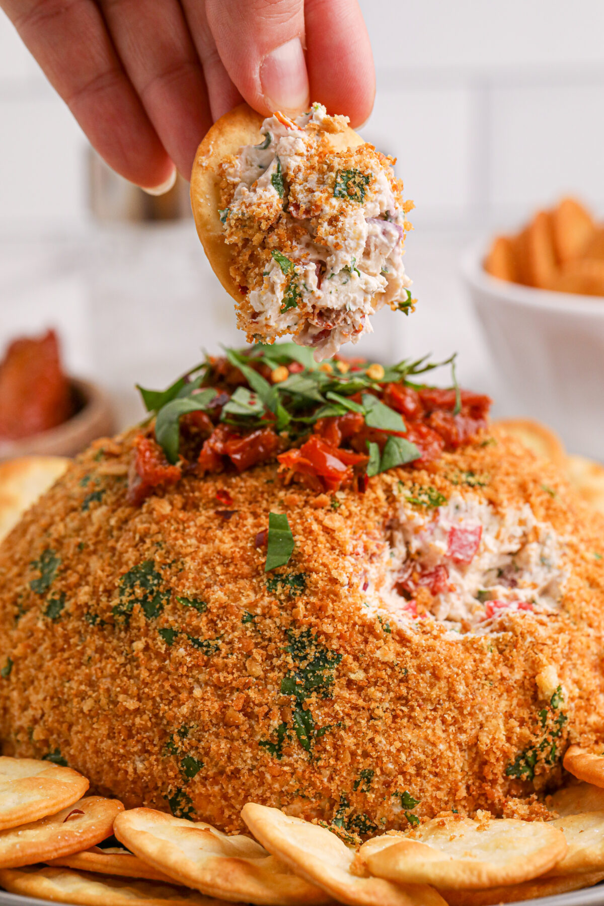 Elevate your party food game with this delicious and easy-to-make bruschetta cheese ball recipe. Your guests will thank you!