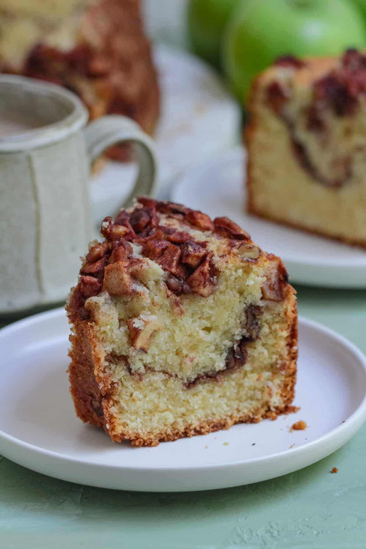 This old-fashioned apple coffee cake is a family favourite - made with a moist sour cream batter, cinnamon apples, and a crunchy topping.