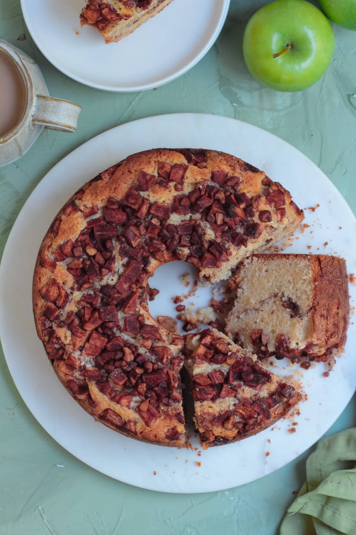 This old-fashioned apple coffee cake is a family favourite - made with a moist sour cream batter, cinnamon apples, and a crunchy topping.