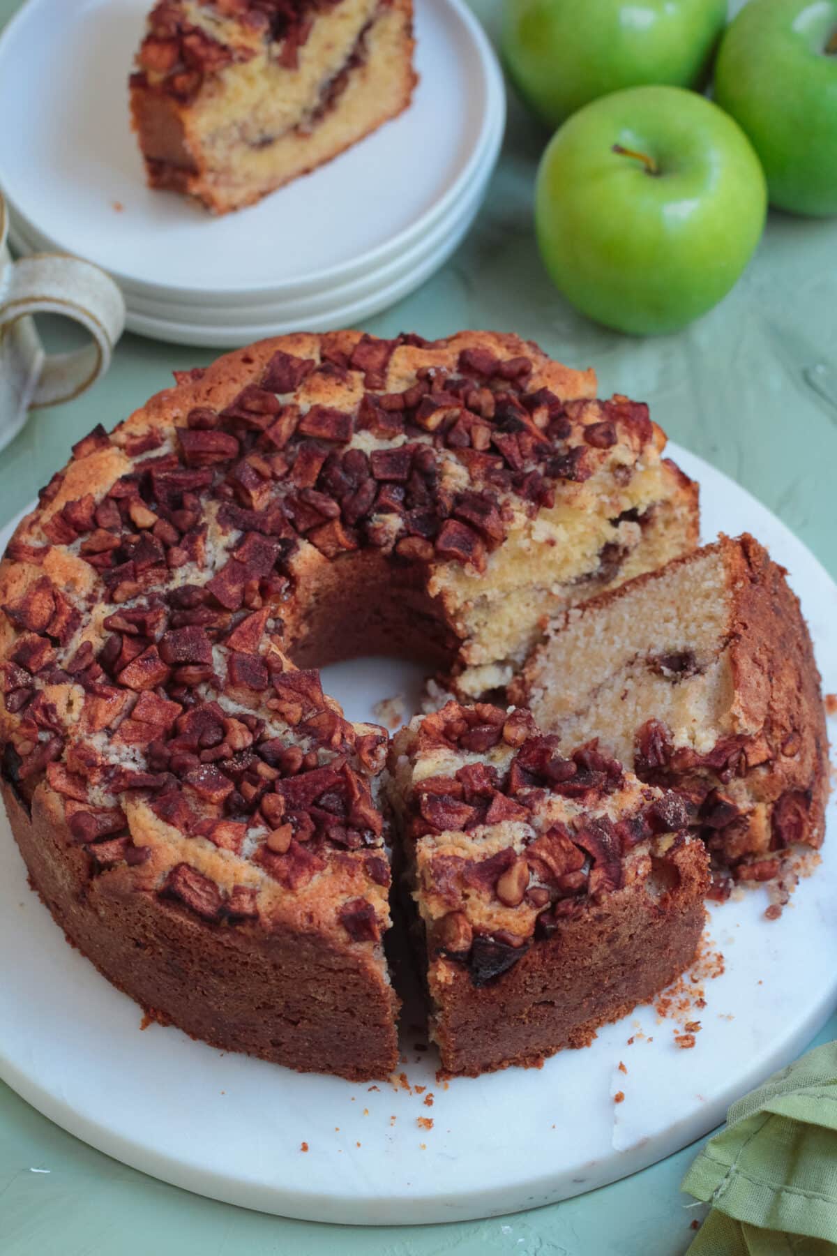 This old-fashioned apple coffee cake is a family favourite - made with a moist sour cream batter, cinnamon apples, and a crunchy topping.