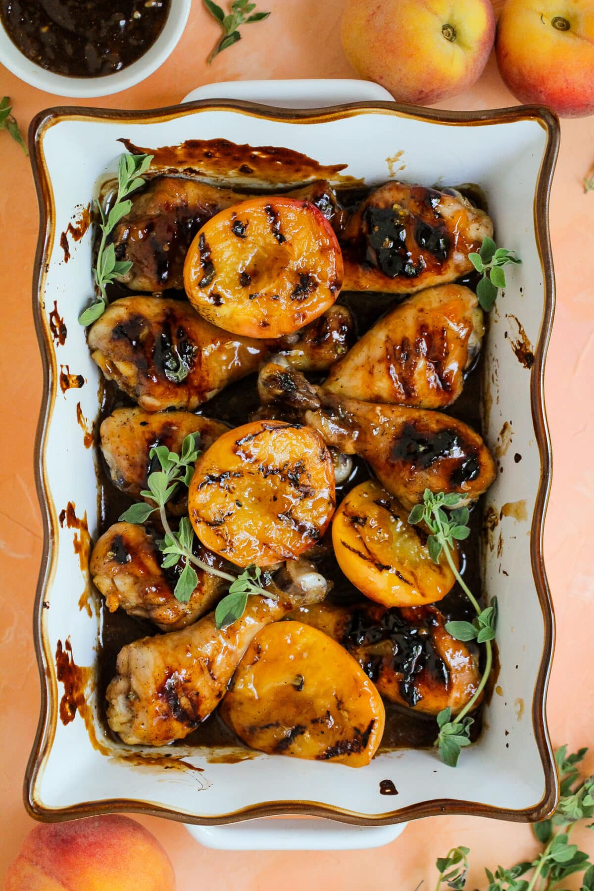 Grilled peach glazed chicken drumsticks are basted in a sweet peach glaze with balsamic - perfect for summer BBQs or family dinners.