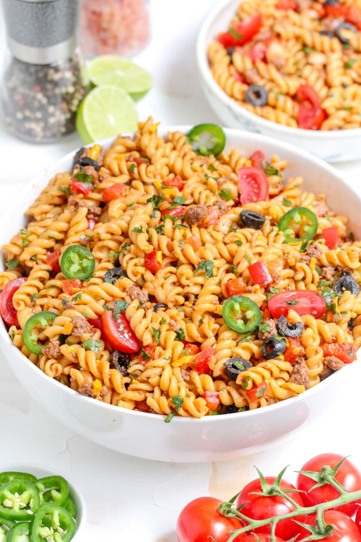 This Taco Pasta Salad is a flavourful summer dish made with seasoned ground beef, fusilli pasta, and a zesty salsa-lime dressing.