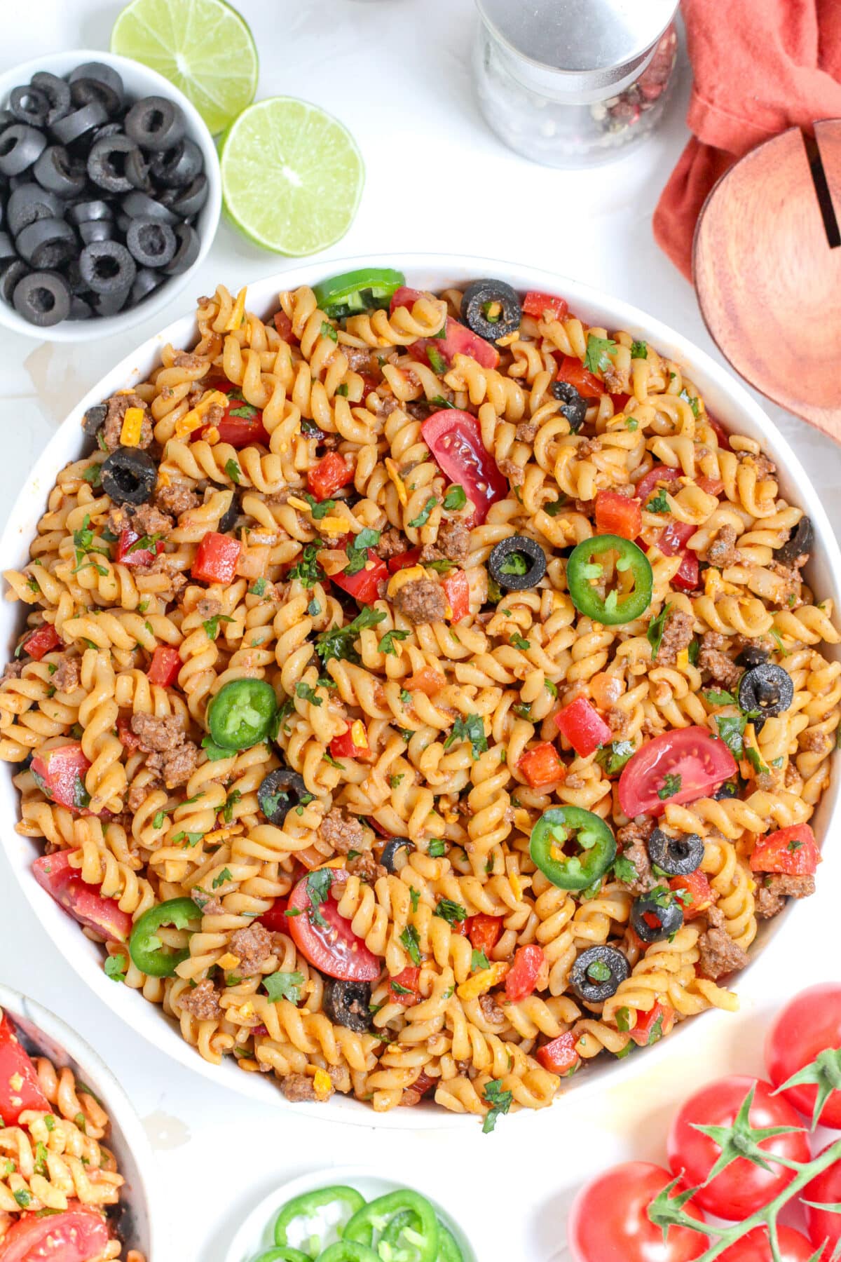 This Taco Pasta Salad is a flavourful summer dish made with seasoned ground beef, fusilli pasta, and a zesty salsa-lime dressing.