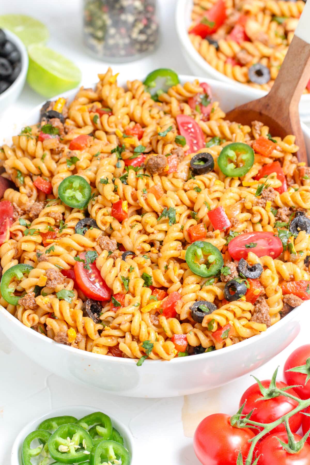This Taco Pasta Salad is a flavourful summer dish made with seasoned ground beef, fusilli pasta, and a zesty salsa-lime dressing.