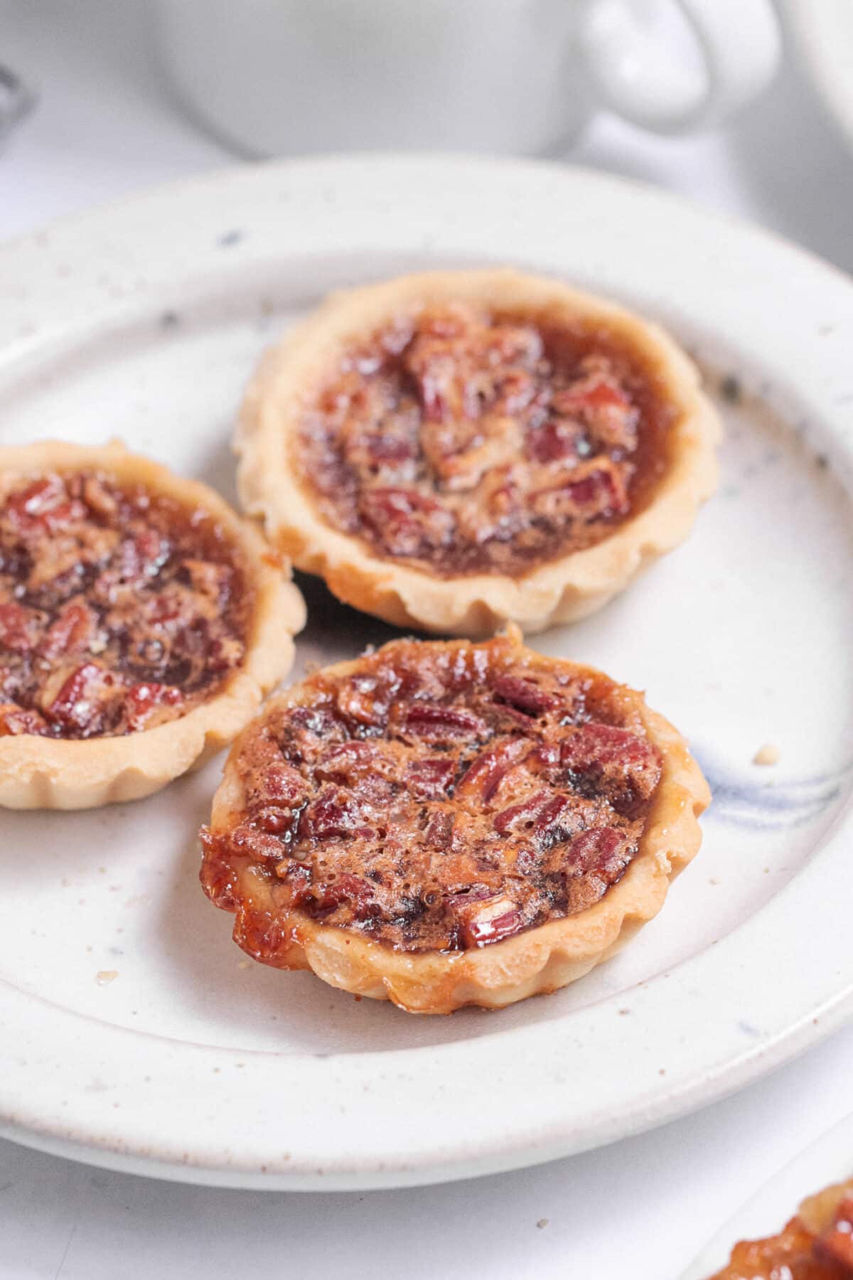Flaky pastry with a gooey, sweet filling – this classic Canadian butter tarts recipe is a beloved treat made with simple pantry ingredients.