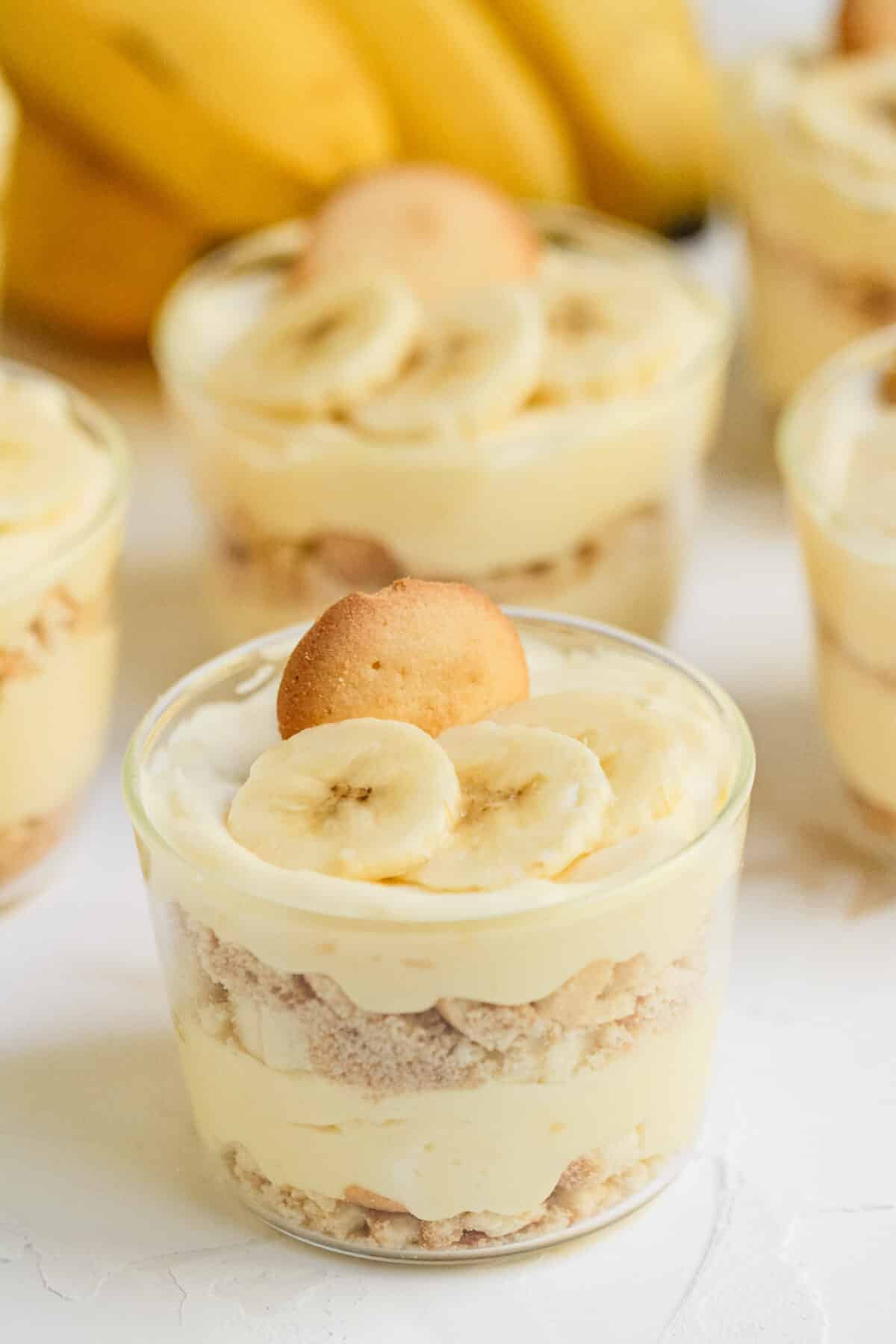 Banana Cream Pie Parfaits with fresh bananas, creamy pudding, whipped cream, and Nilla wafers. An easy no-bake dessert for any occasion.