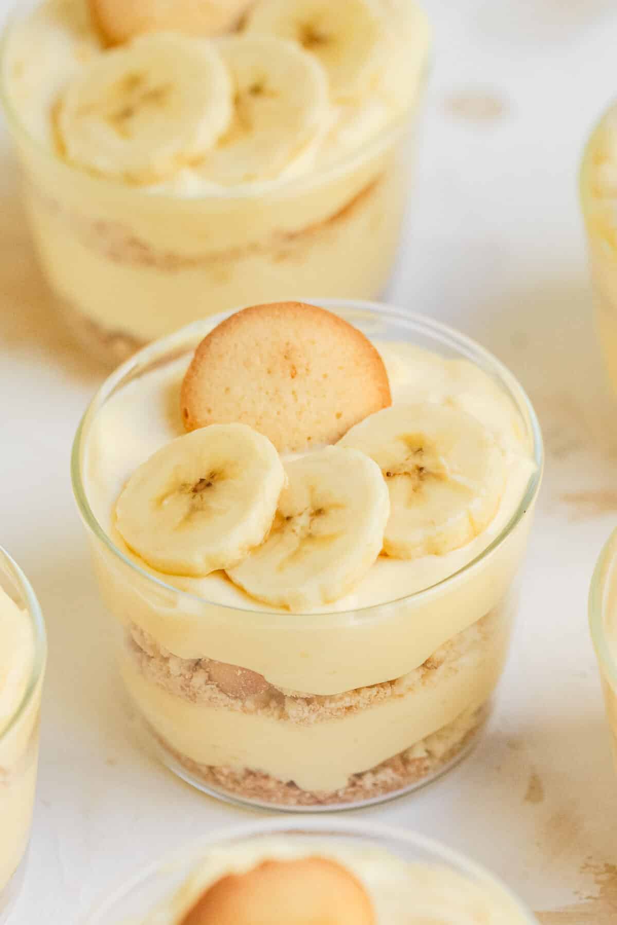 Banana Cream Pie Parfaits with fresh bananas, creamy pudding, whipped cream, and Nilla wafers. An easy no-bake dessert for any occasion.