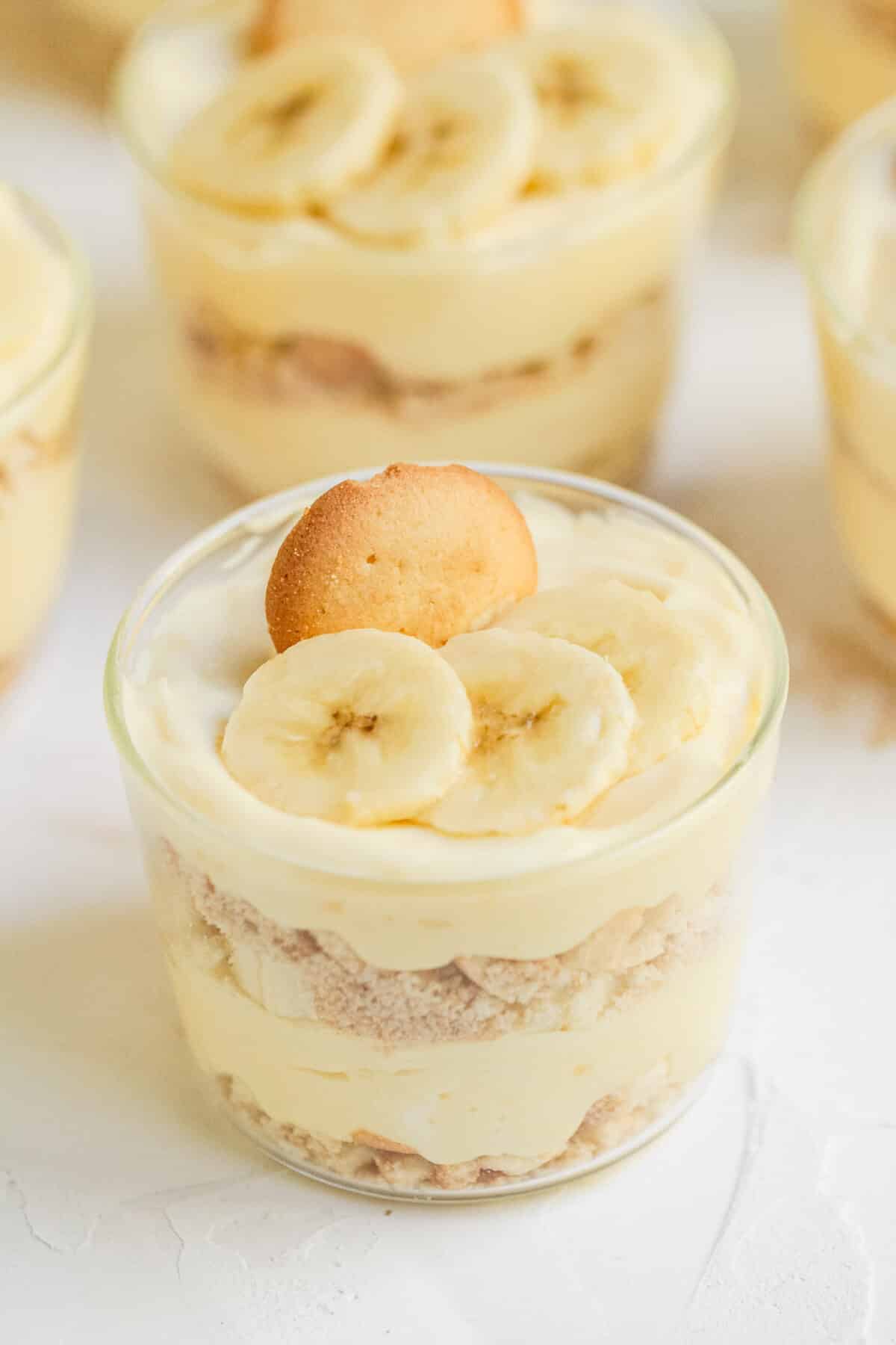 Banana Cream Pie Parfaits with fresh bananas, creamy pudding, whipped cream, and Nilla wafers. An easy no-bake dessert for any occasion.
